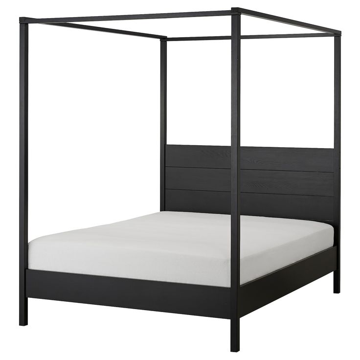 a black bed frame with white sheets and pillows on the bottom side, in front of a white background