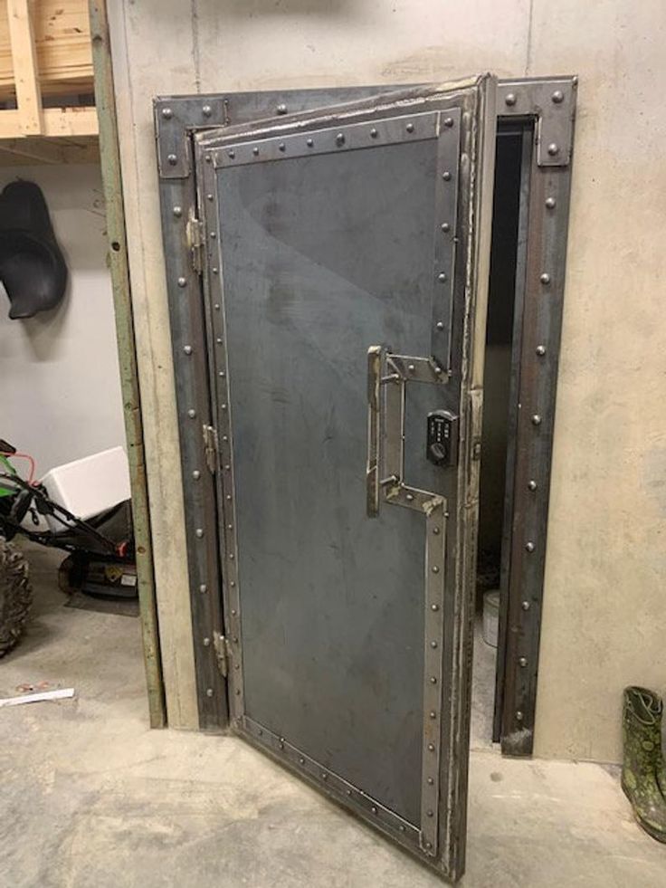 an open metal door sitting inside of a garage