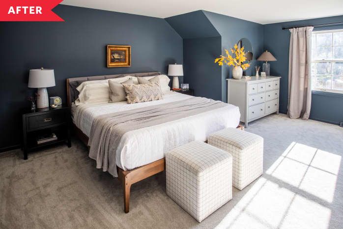 a bedroom with blue walls and white furniture