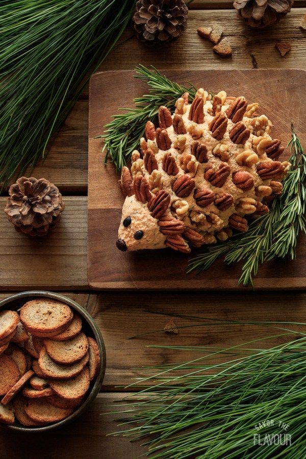 an instagram photo with a hedge cookie on it and pine cones in the background