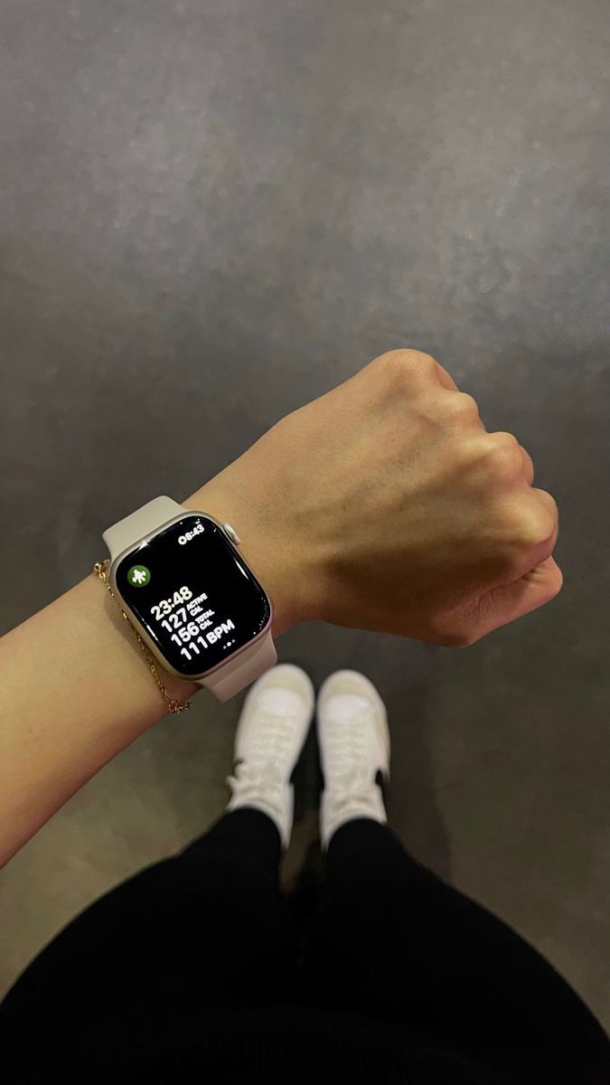 a person wearing an apple watch on their wrist