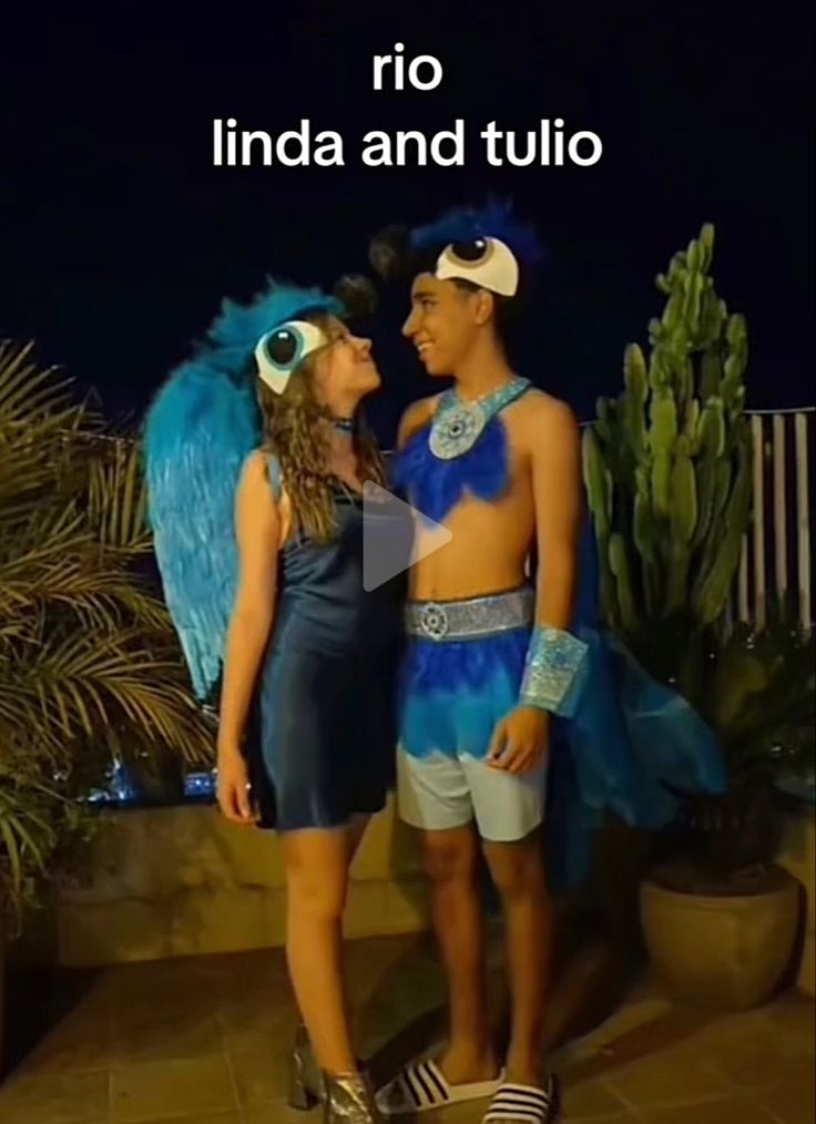 two people standing next to each other with wings on their heads and the caption reads rio linda and tulipo