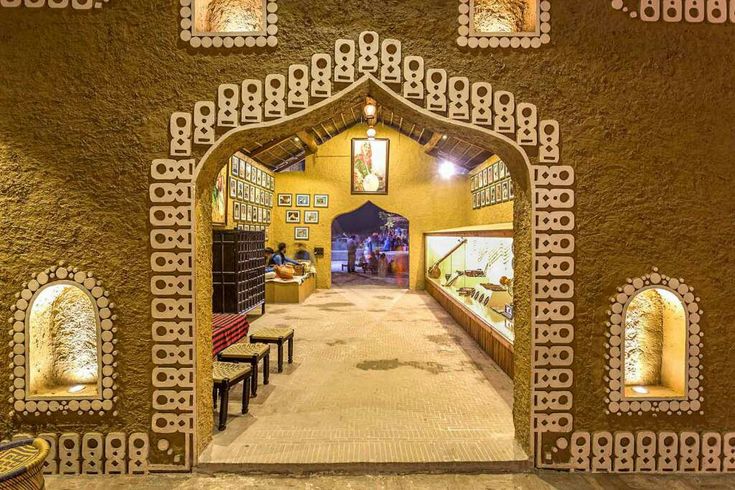 an archway leading to a restaurant with benches