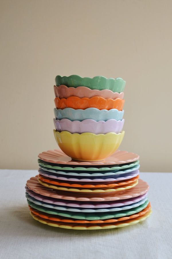 a stack of colorful bowls sitting on top of each other