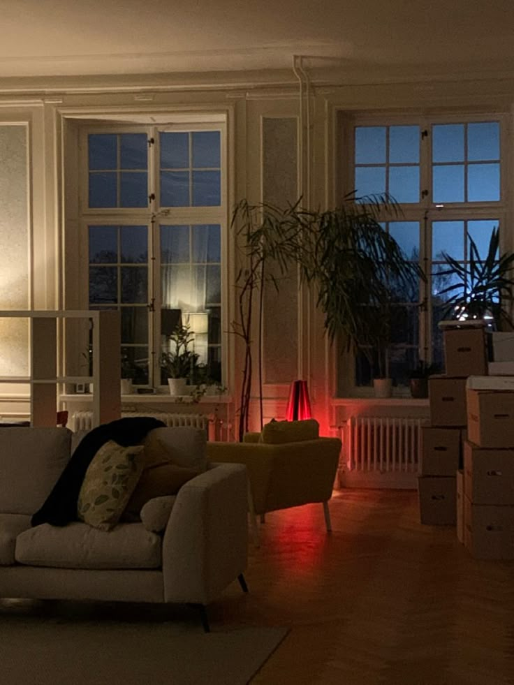 a living room filled with furniture and lots of windows