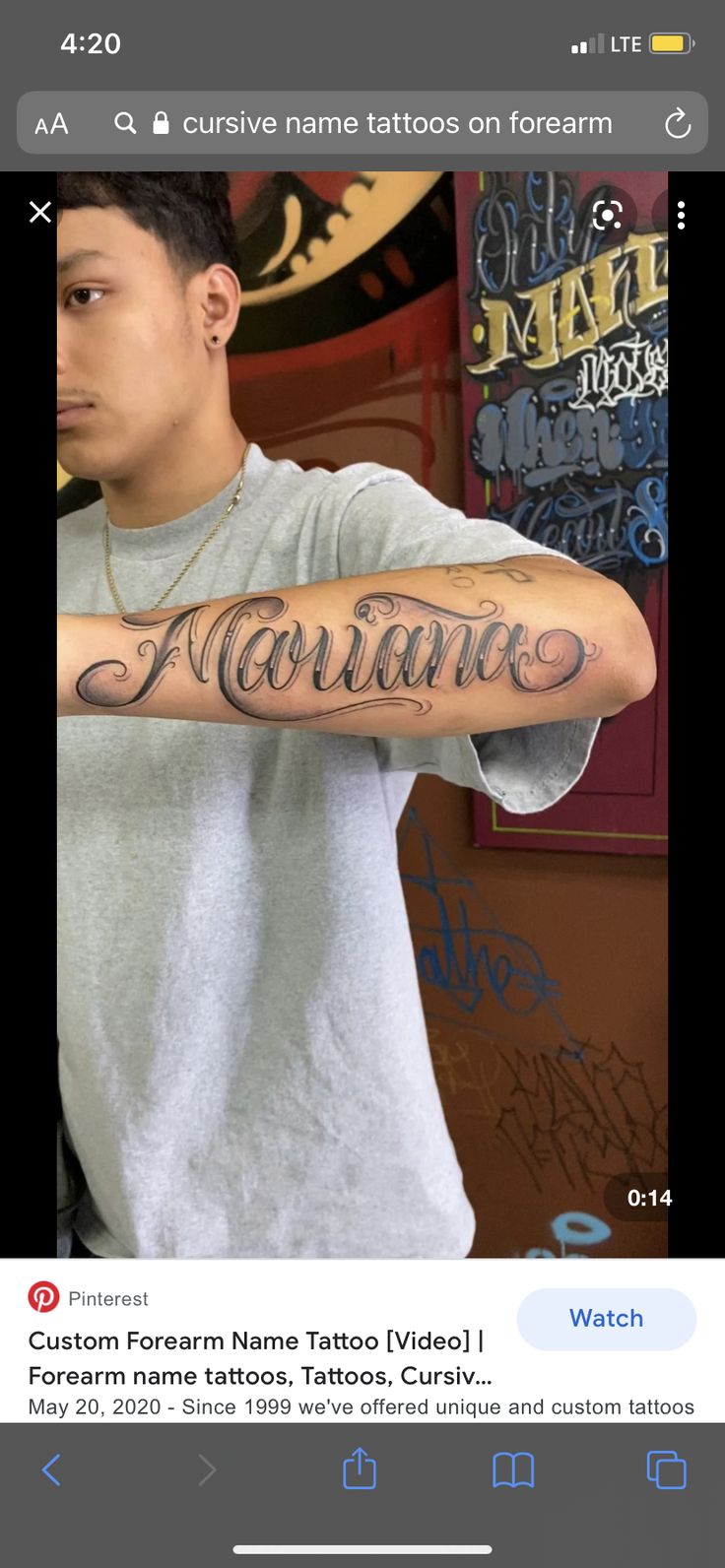 a man with a tattoo on his arm and the words romane written in cursive writing