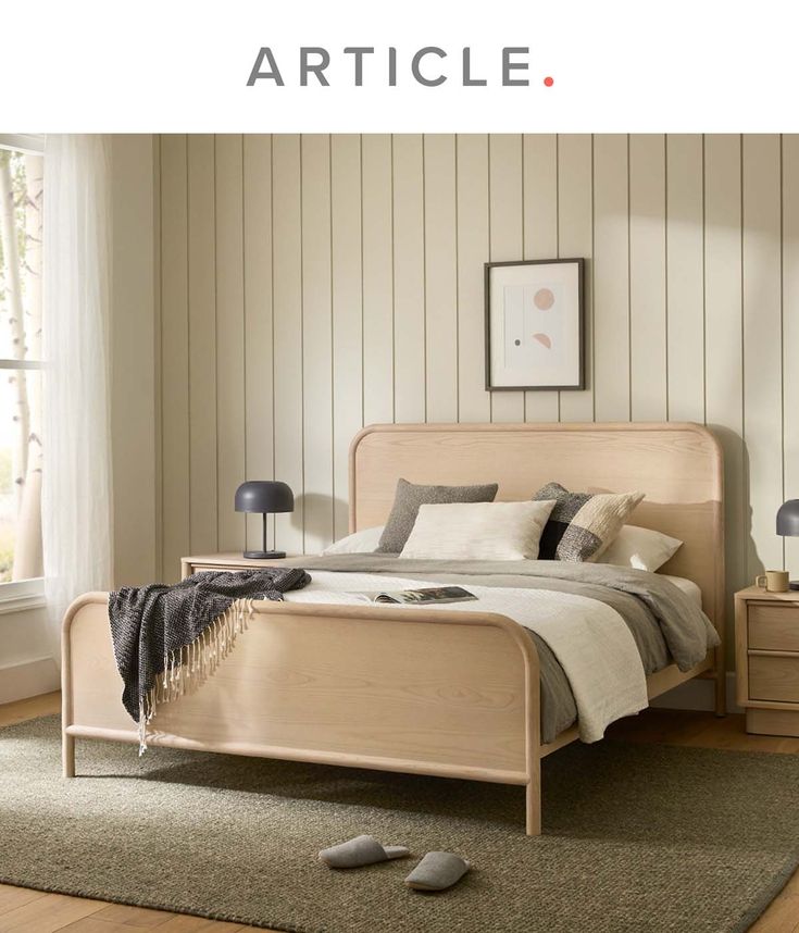 a bed room with a neatly made bed and two nightstands