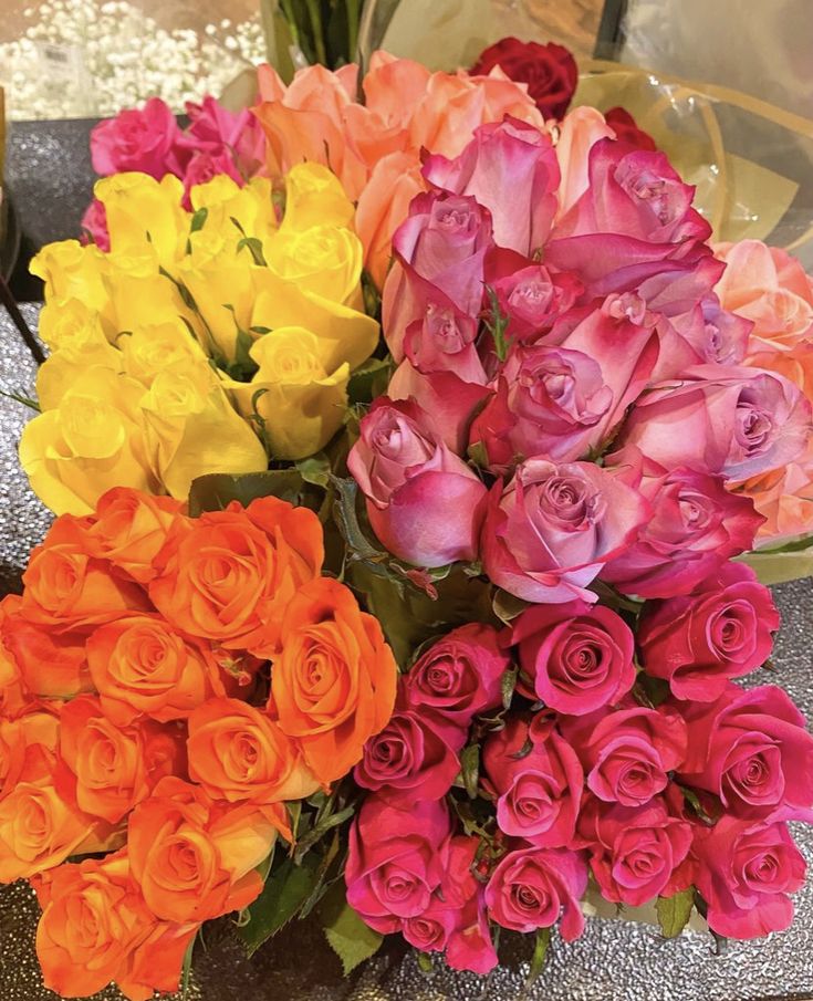 a bunch of flowers that are sitting on a table