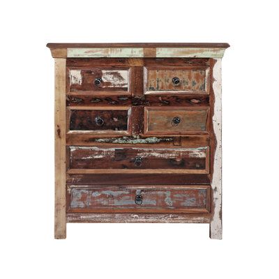 an old wooden dresser with drawers and knobs on it's sides, against a white background