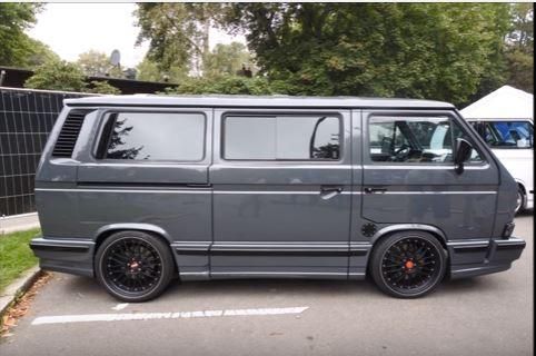 an old van parked in a parking lot