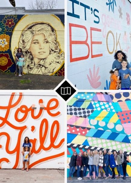 people standing in front of a colorful wall with words painted on it and an image of a woman holding a child