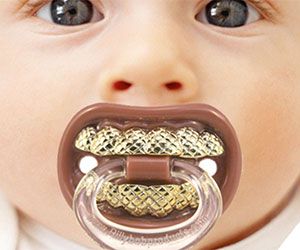 a baby with a pacifier in it's mouth