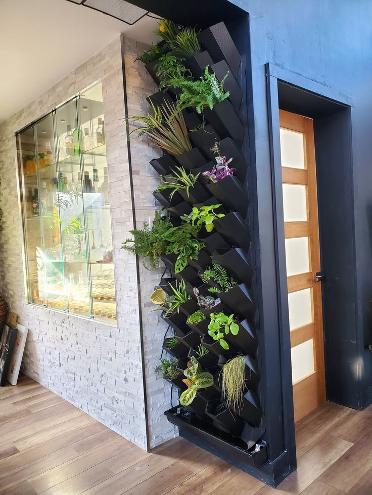 a vertical planter in the corner of a room