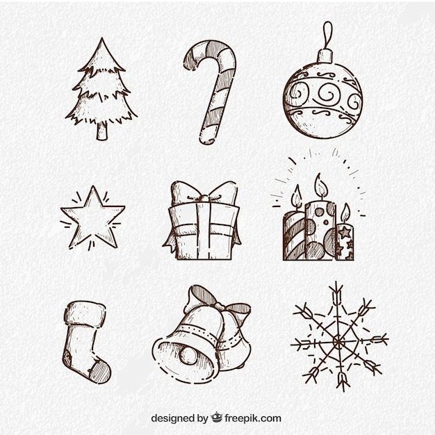 hand drawn christmas icons on white paper