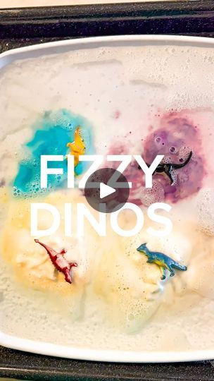 the words fizzy dinos are painted on a tray