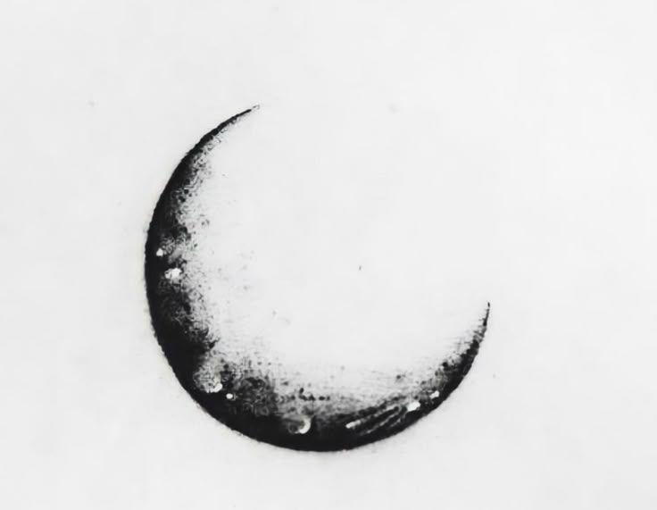 a black and white photo of a half - moon in the sky with drops of water on it