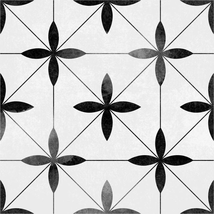 a white and black tiled wall with an interesting design