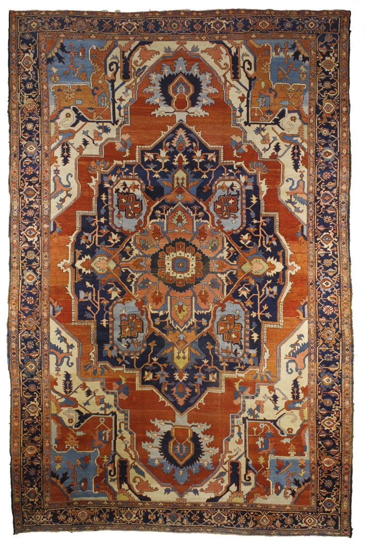 an antique persian rug with blue, orange and red colors on the bottom half of it