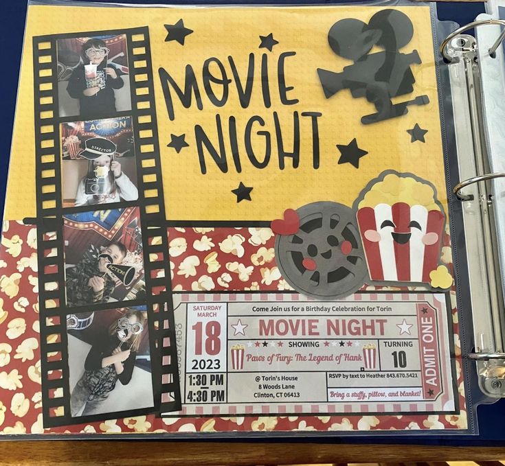 a movie night scrapbook is open to show pictures and film reels on it