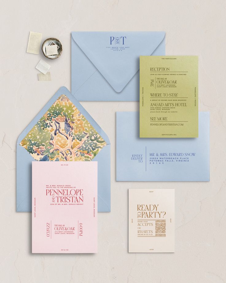 an assortment of wedding stationery and envelopes