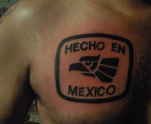 a shirtless man with a mexican tattoo on his left chest and the words hecho en mexico written in black ink