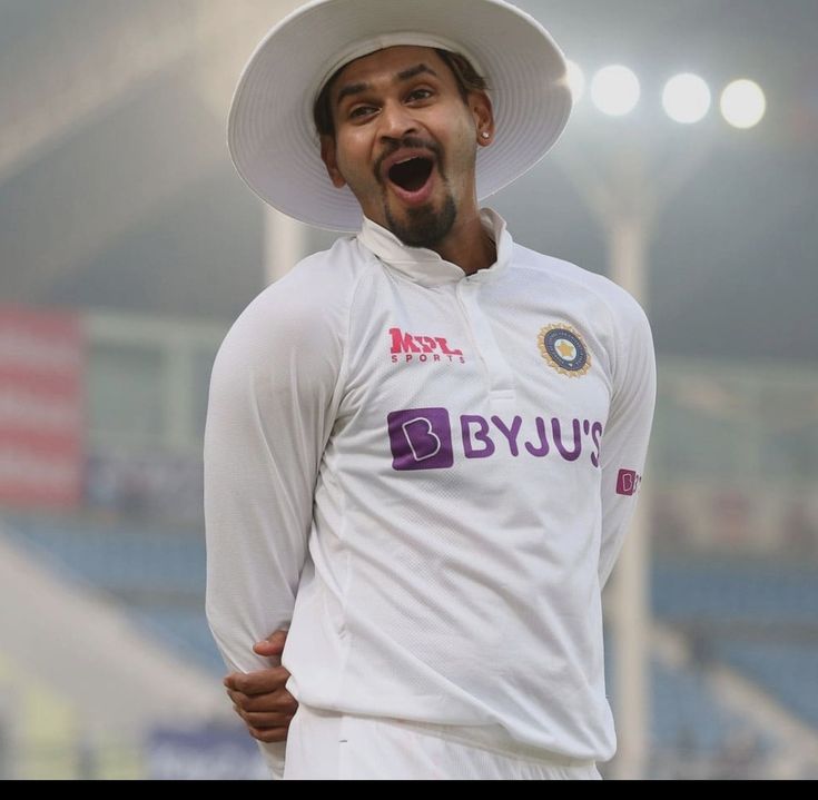 a man wearing a white hat and holding his mouth open