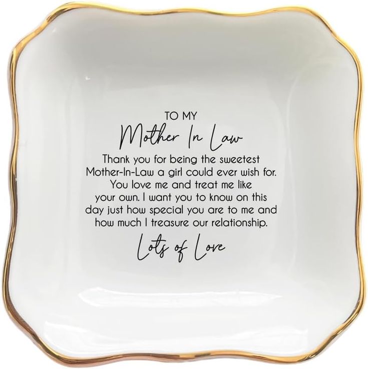 a mother's love plate with handwriting on the front and bottom, in gold trimming