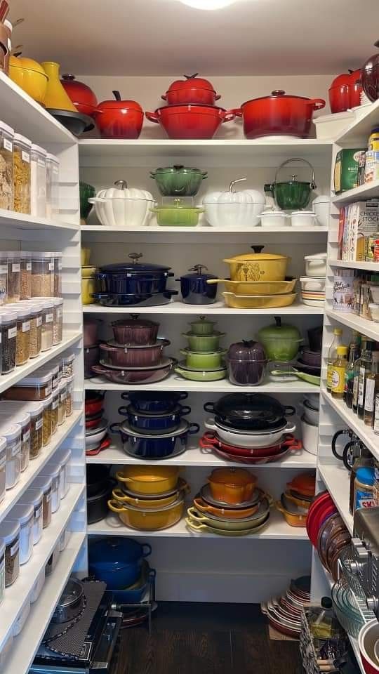 an open pantry filled with lots of dishes and bowls