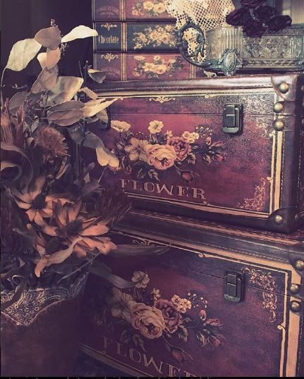 an old trunk with flowers on it