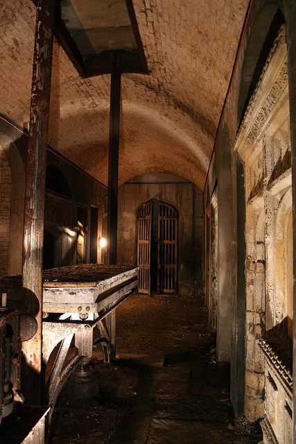 an old, run down building with lots of rust on the walls and flooring