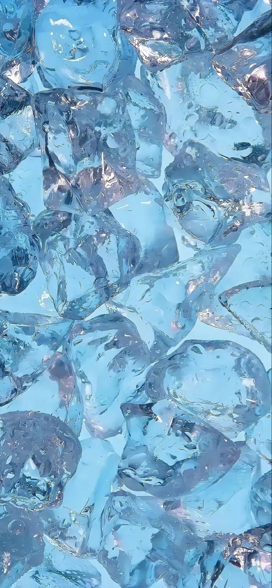 an image of ice cubes that are in the water with blue and white colors