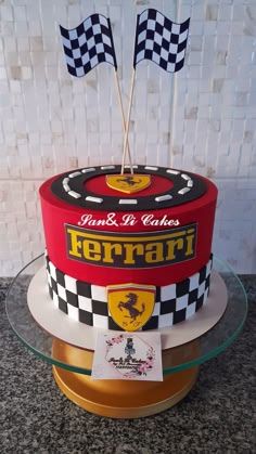 a red and black cake sitting on top of a table