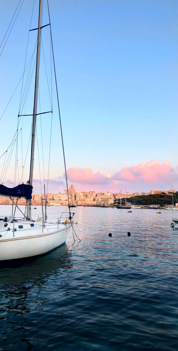 a sailboat floating on top of a body of water