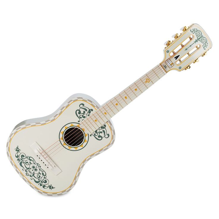 a white guitar with green and yellow designs on the body, sitting upright in front of a white background