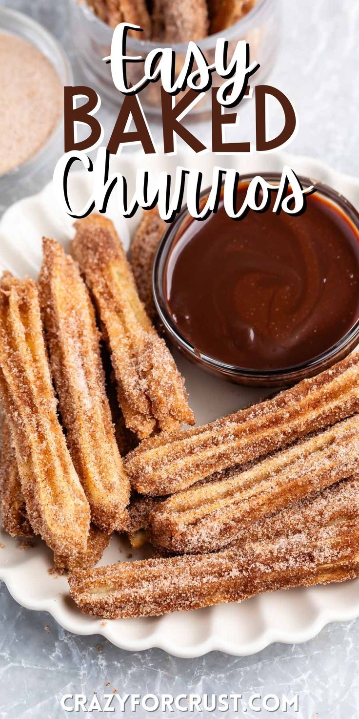 baked churros on a plate with dipping sauce