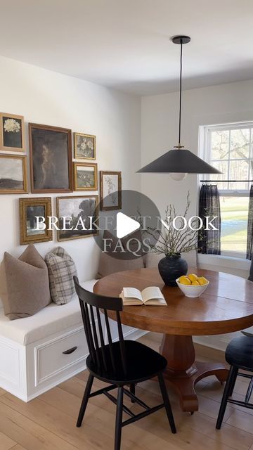 a dining room table with four chairs and a bench in front of the window that is open