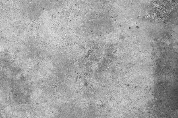 a black and white photo of a concrete wall with cracks in the cement, looking like it has been scratched or stained