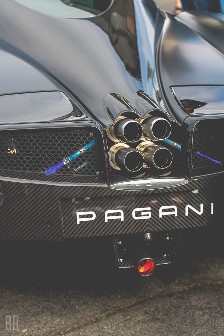 the front end of a black sports car