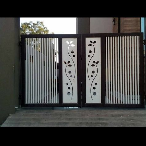 an iron gate with decorative designs on it