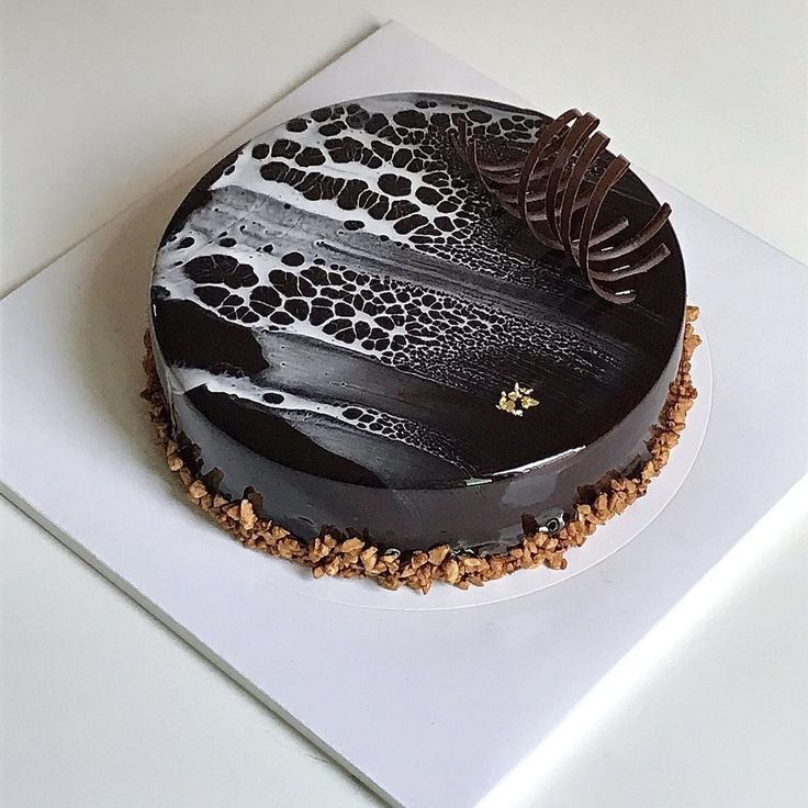 there is a cake with black and white designs on it