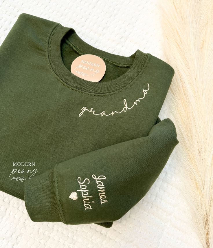 GRANDMA Embroidered sweatshirt, grandma sweatshirt with grandkids name, grandma Crewneck Sweatshirt  Custom grandma Shirt Christmas Gift Perfect gift for mama for Mothers day, moms birthday, baby showers and more! Mama Embroidered sweatshirt, Mama Crewneck Sweatshirt, Pregnancy Reveal Gift for New mom, Custom Mom Shirt with Kids Names, Mama Sweater first picture is military green sweatshirt with #3 thread wording can be changed to: mom, grandma, nana, granny, gigi, mimi, dad, dada,  - please wri Grandma Embroidery Sweatshirt, Grandma Embroidered Sweatshirt, Embroider Knitting, First Time Grandma Gifts, Grandma Christmas Gifts, Grandma Hoodie, Monogram Inspiration, Mama Embroidered Sweatshirt, Grandma Crewneck