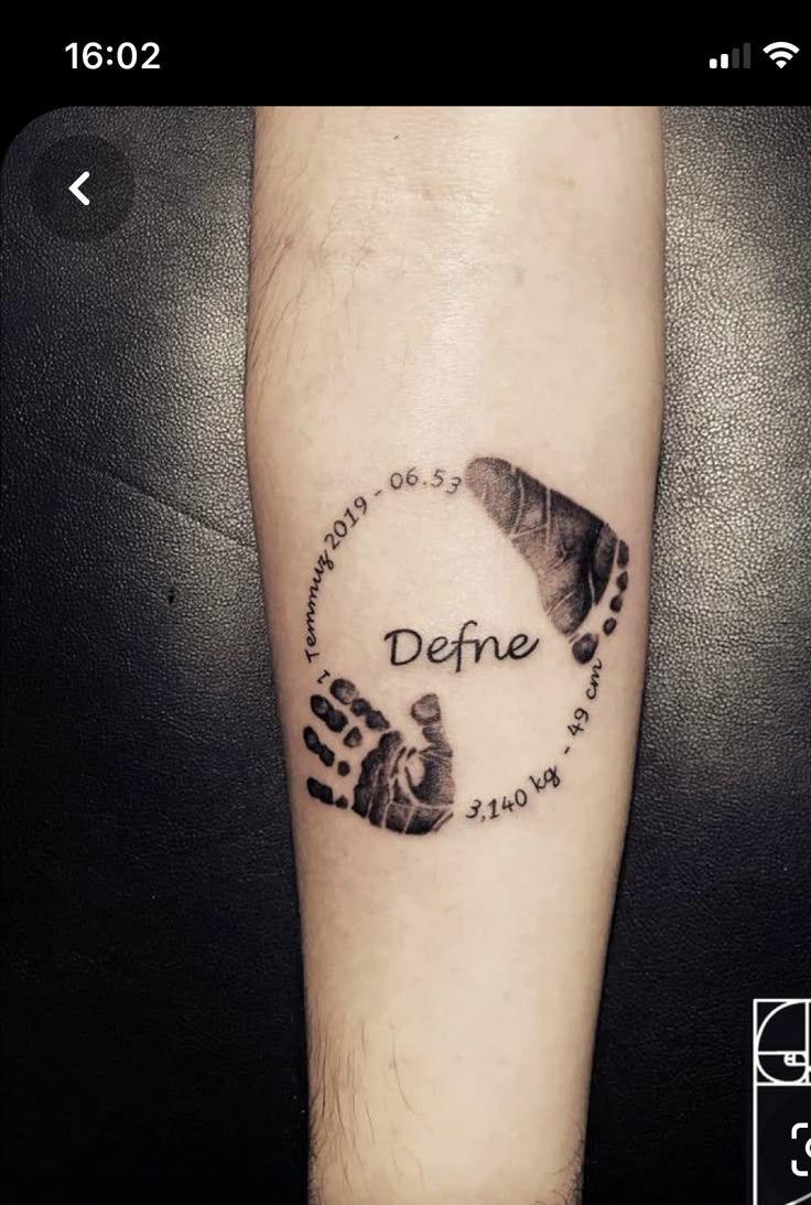 a person with a tattoo on their arm that says, defne and two hands