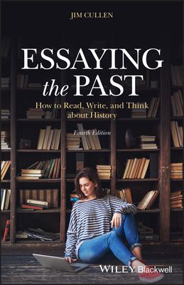 a woman sitting on the floor in front of bookshelves