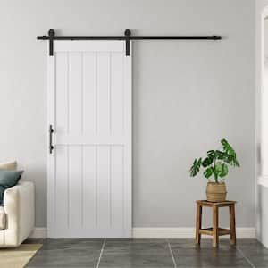 a living room with a couch, chair and sliding barn door