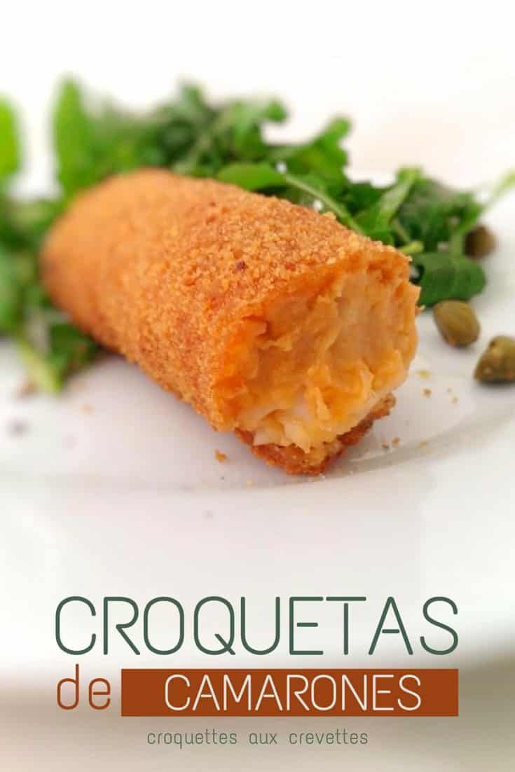 a close up of food on a plate with text that reads croquettass de camarones