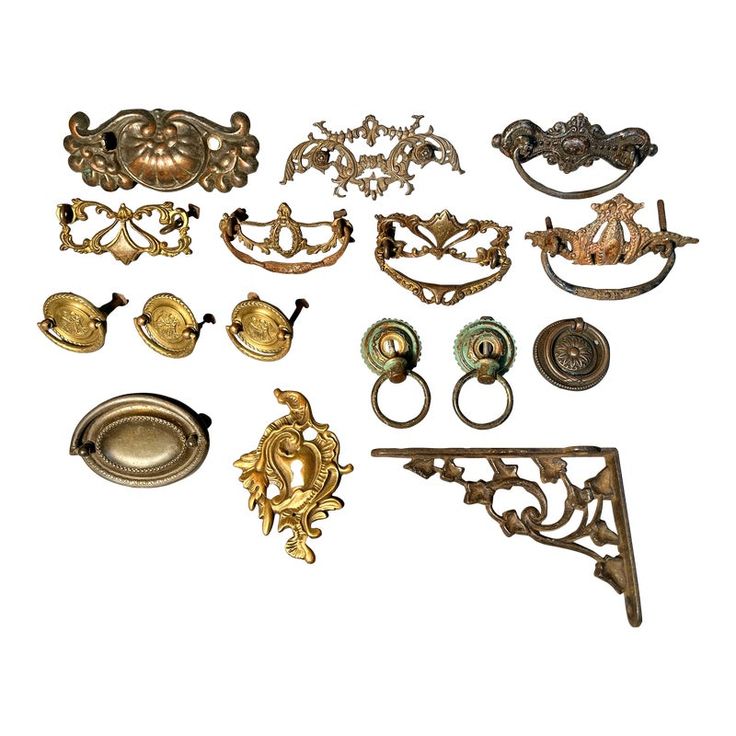 an assortment of antique brass drawer pulls and knobs