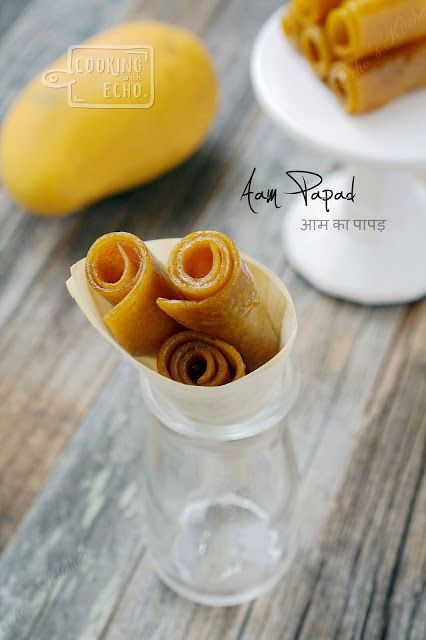 there are three pieces of food in the small glass cup on the table next to each other