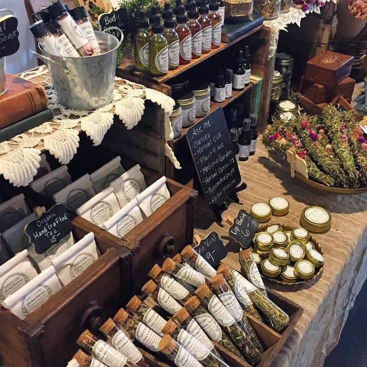 an assortment of spices on display at a market