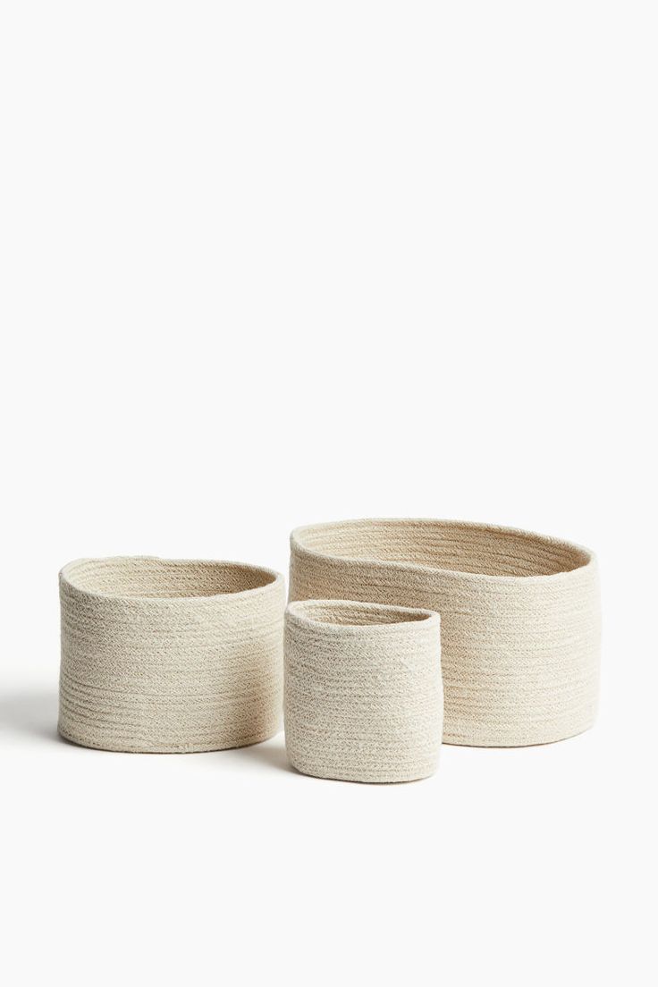 two white bowls sitting next to each other