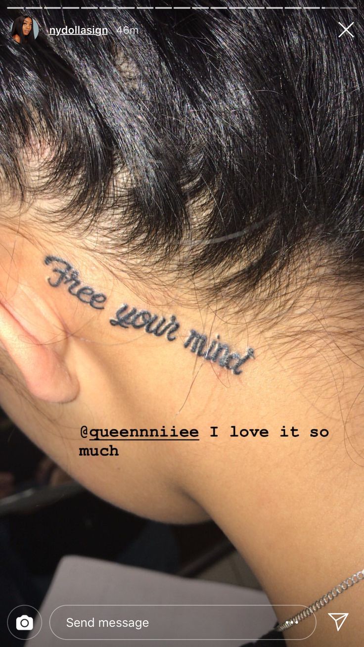 the back of a woman's neck with words written on it